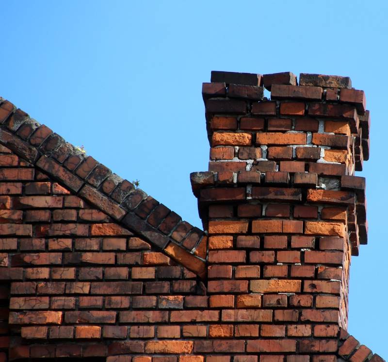 Damaged chimney on an Waltham  home showing cracks and missing mortar